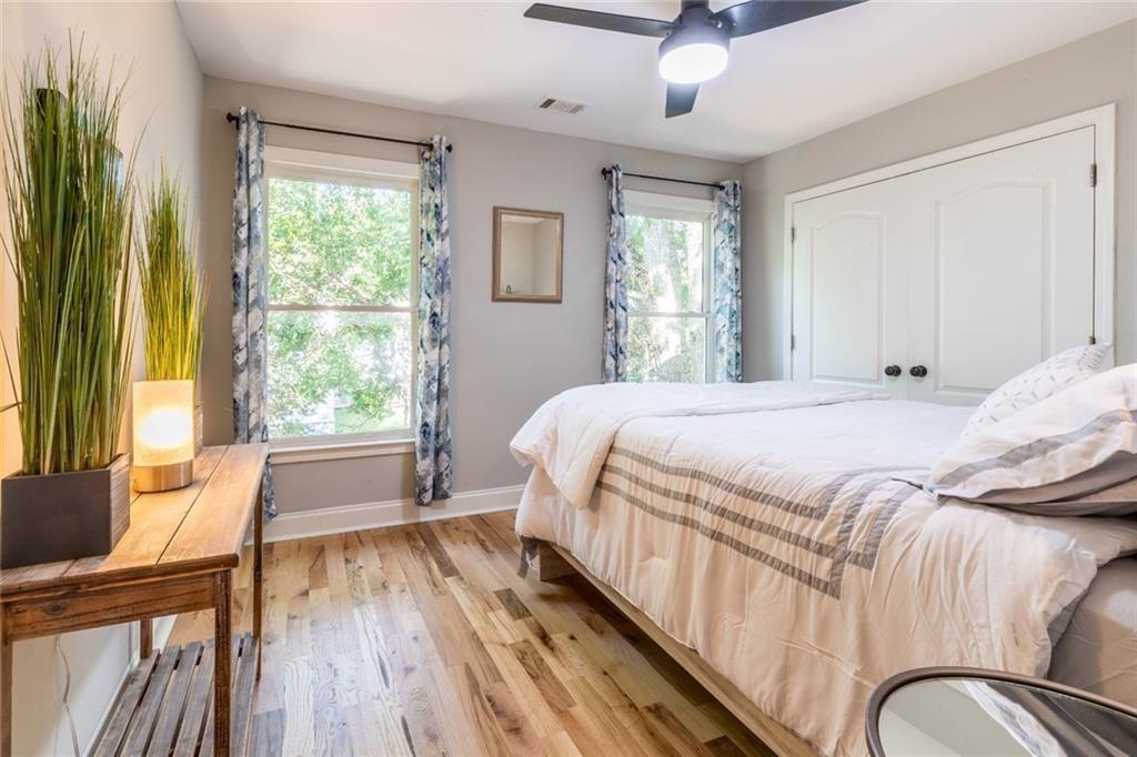 955 Coleman Street Southwest Atlanta, GA 30310 - Photo 50 of 56 a bedroom with a bed and wooden floor