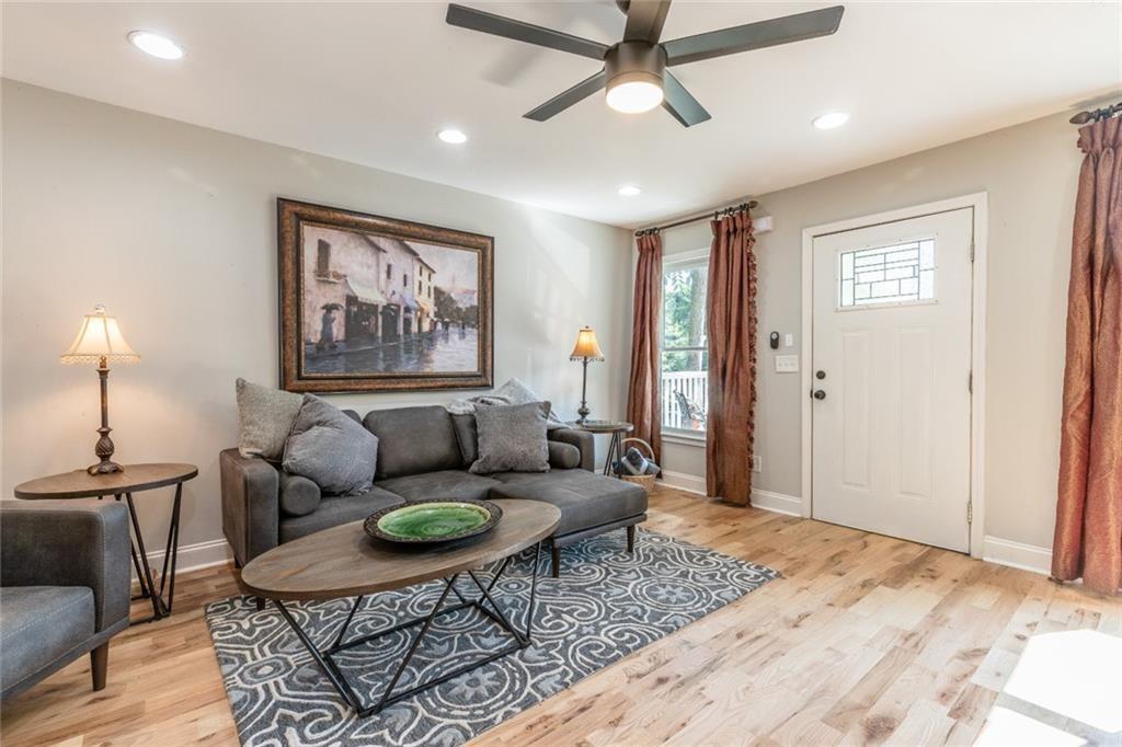 955 Coleman Street Southwest Atlanta, GA 30310 - Photo 6 of 56 a living room with furniture and a wooden floor