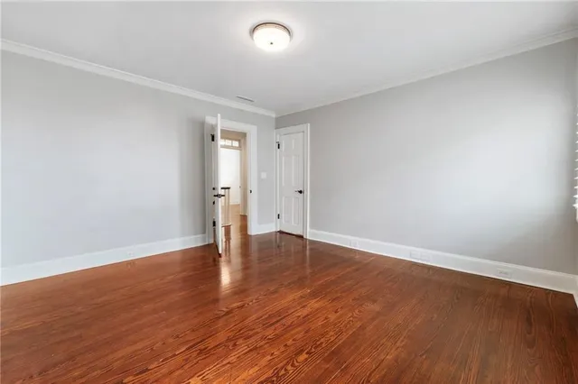 a bathroom with a tub shower sink and mirror