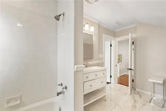 an empty room with wooden floor closet and windows