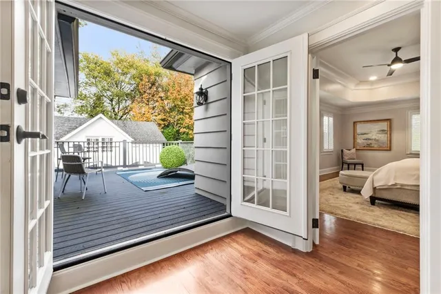 a view of a roof deck with wooden floor and fence