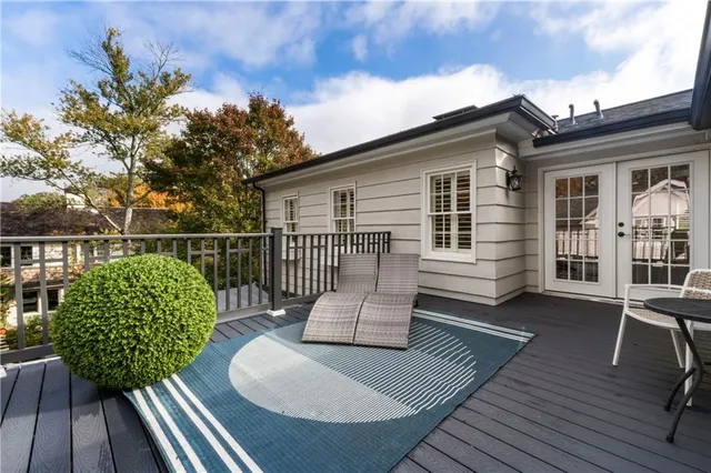 a living room with furniture and a painting