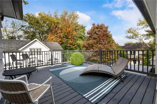 a spacious bathroom with a bathtub and shower