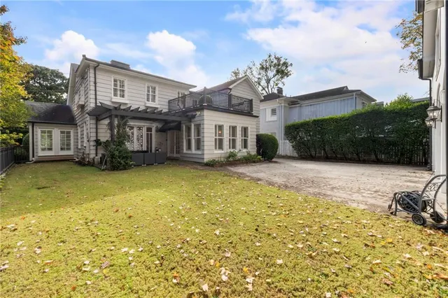 a living room with furniture wooden floor and a chandelier