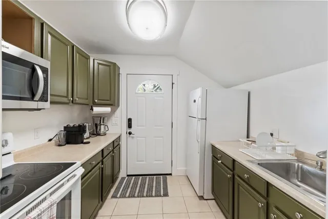 a front view of a house with sitting area