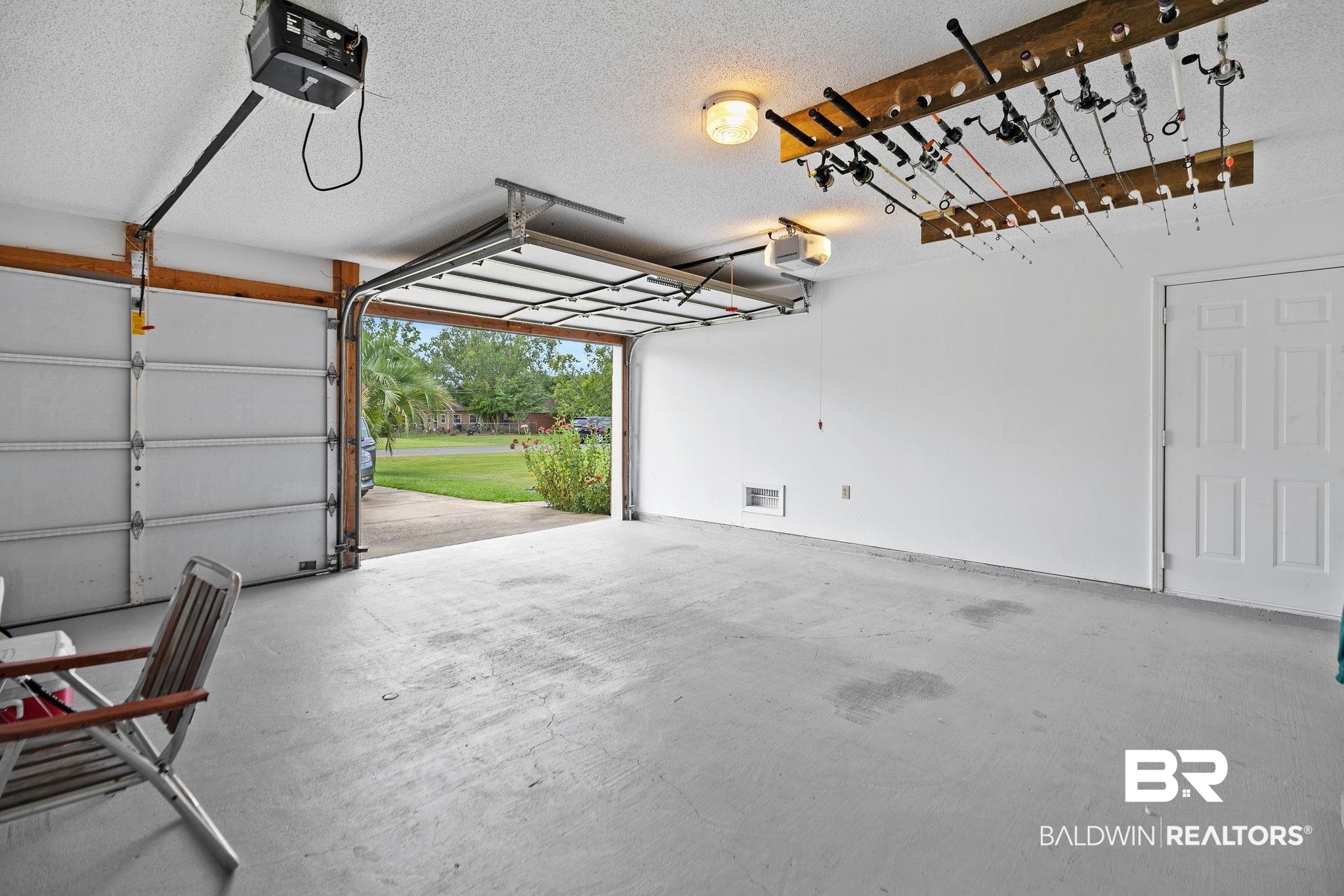 53 Magnolia Circle Foley, AL 36535 - Photo 31 of 33 Garage featuring a garage door opener