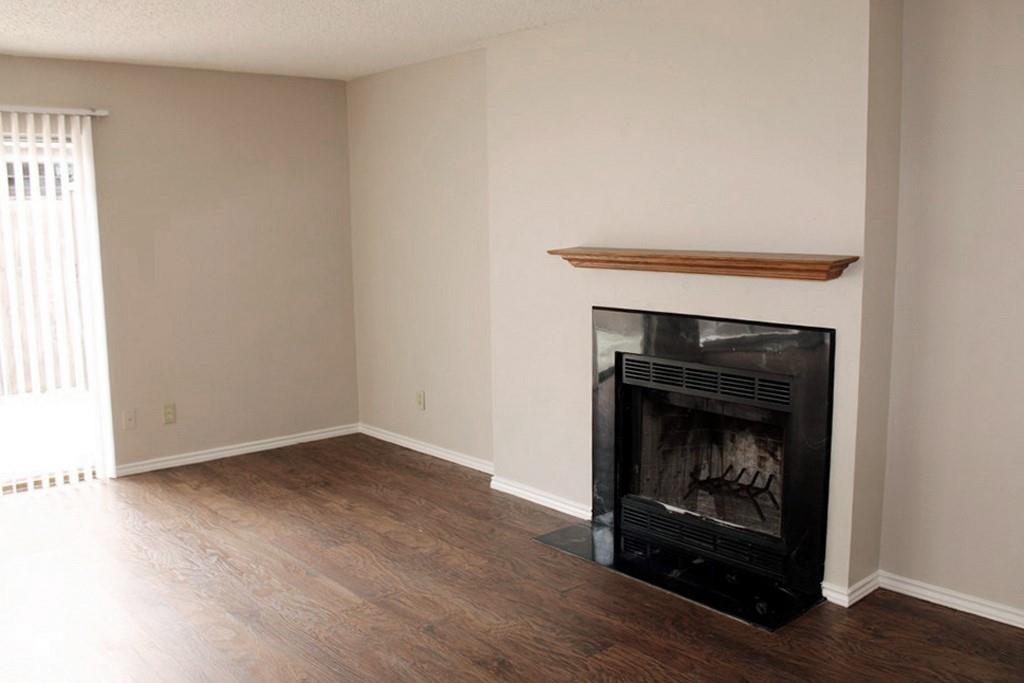 1725 East Grauwyler Road, Unit 138 Irving, TX 75061 - Photo 3 of 20 Living Room with a Cozy Fireplace