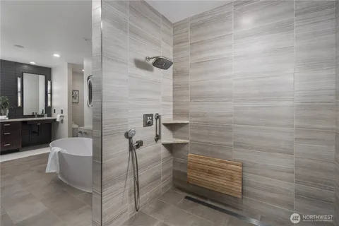 a bathroom with a double vanity sink and a mirror