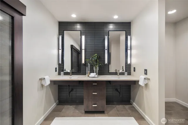 a spacious bedroom with a large bed and a large window