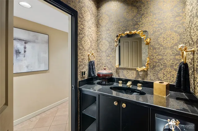 a bathroom with a double vanity sink and a mirror