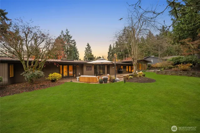 a view of a lake with couches and trees