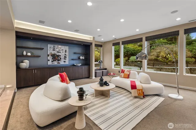 a living room with furniture and a large window