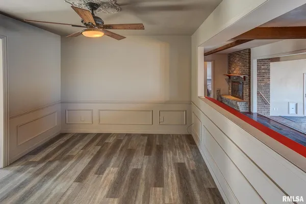 a view of a room with rack and wooden floor