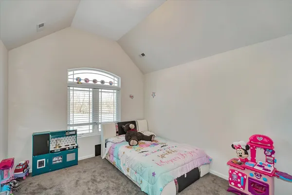 a bed room with a bed and a table