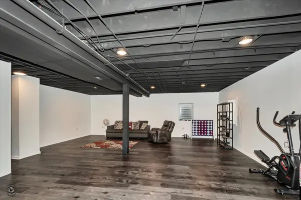 a view of room with wooden floor