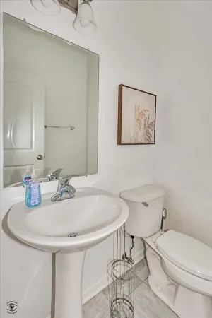 a view of a storage and utility room with washer and dryer