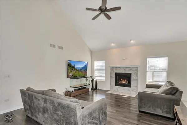 a living room with furniture and a fireplace