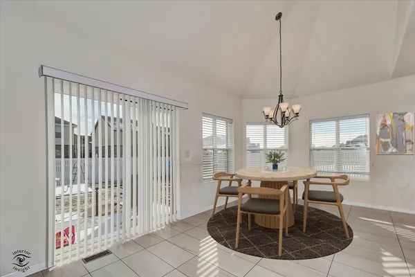 a view of a dining room with furniture