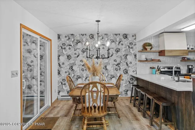 a view of a chairs and table in the balcony