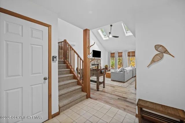 a kitchen with stainless steel appliances a stove a sink and a refrigerator