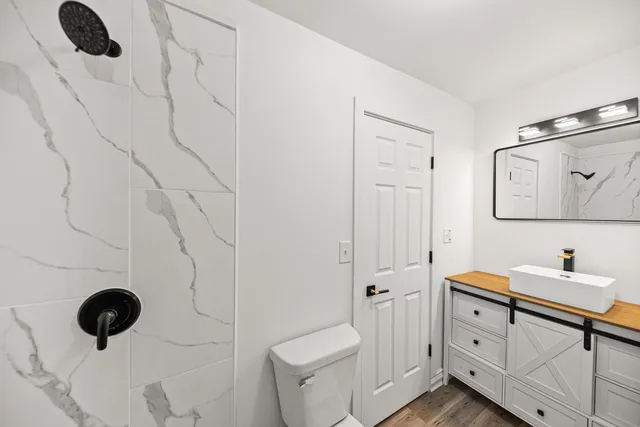 a bathroom with a sink and a mirror