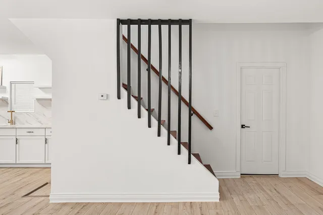 a view of entryway with wooden floor