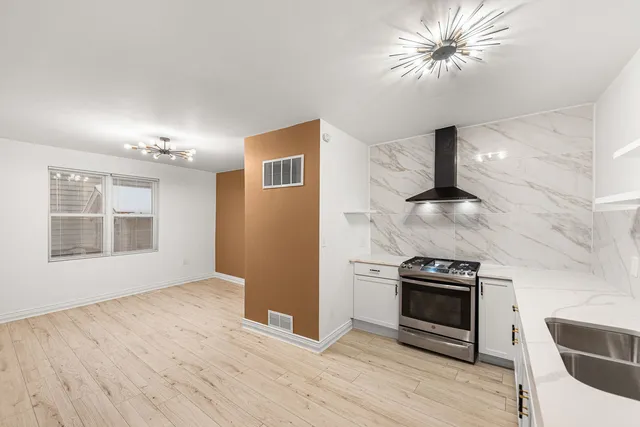a view of a kitchen with an oven and a refrigerator