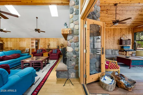 a view of a city from a dining room with wooden floor