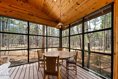 a living room filled with furniture and a chandelier