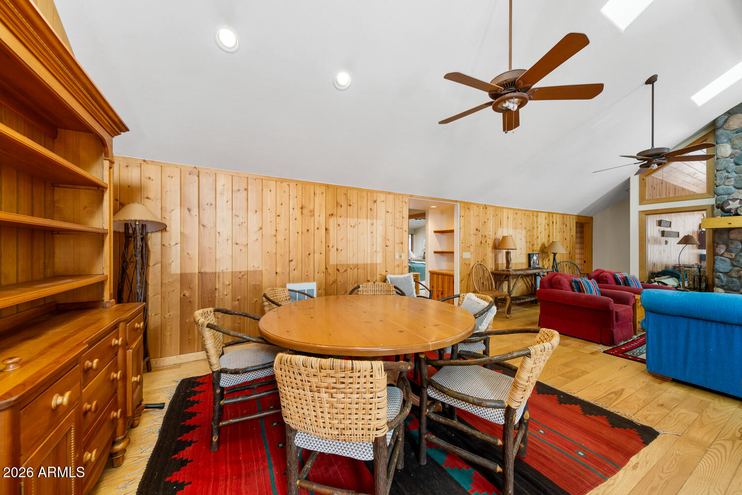 2539 Butterfly Lane Pinetop, AZ 85935 - Photo 23 of 61 a living room with furniture a rug and a chandelier