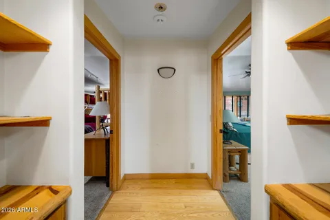 a dining room with furniture window and wooden floor