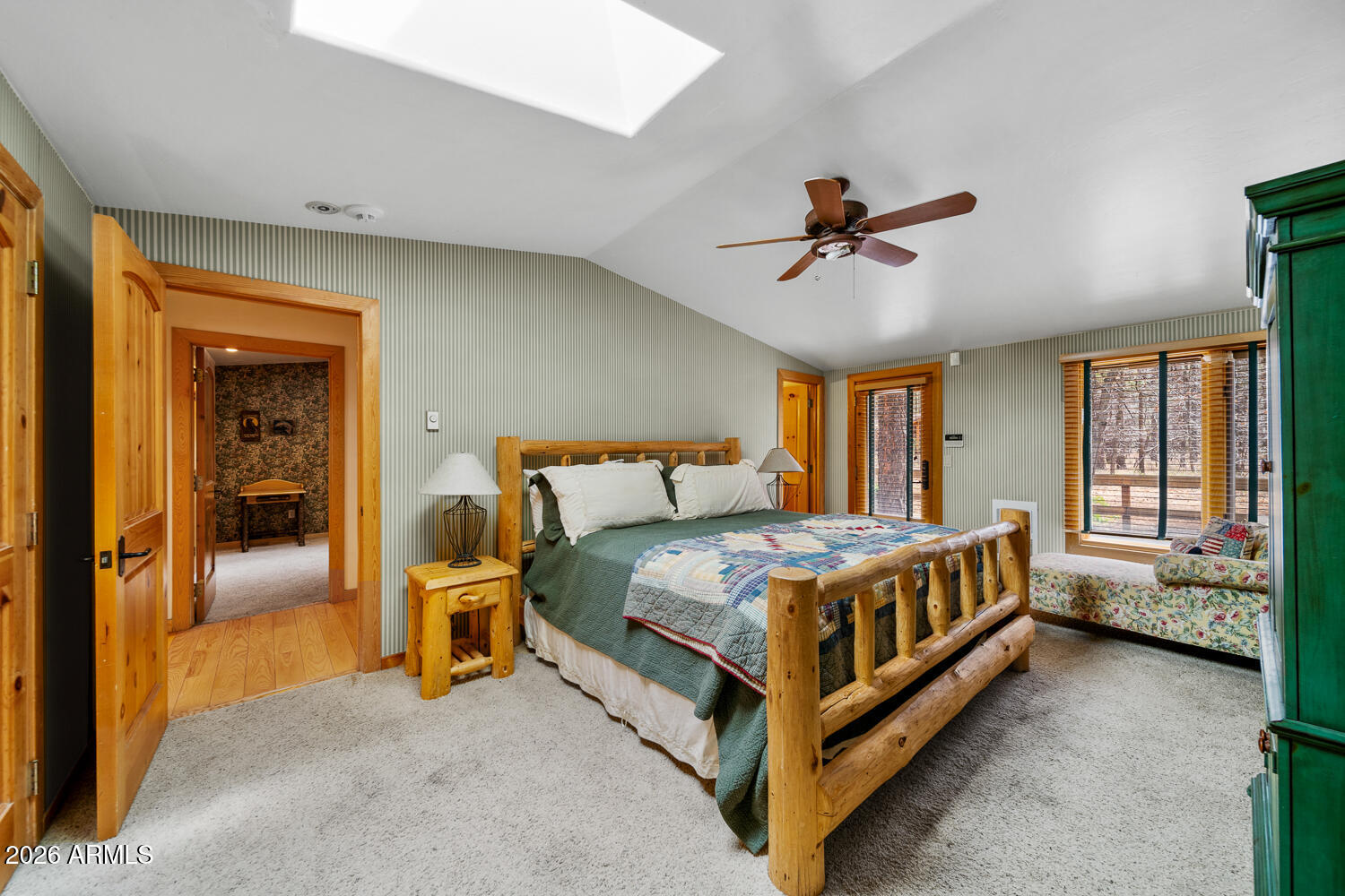 2539 Butterfly Lane Pinetop, AZ 85935 - Photo 29 of 61 a bed room with a bed and a chandelier