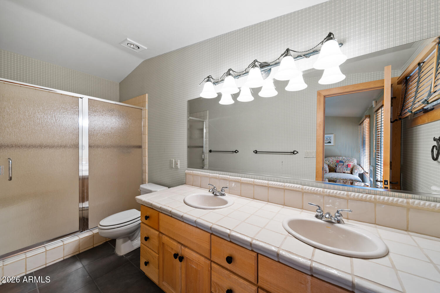 2539 Butterfly Lane Pinetop, AZ 85935 - Photo 31 of 61 a bathroom with a double vanity sink mirror and toilet