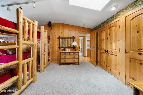 a kitchen with granite countertop a sink and cabinets