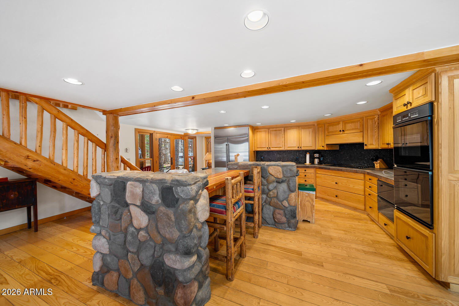 2539 Butterfly Lane Pinetop, AZ 85935 - Photo 36 of 61 a living room with couches and kitchen view with wooden floor