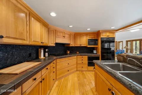 a bedroom with a bed and a view of en suite bathroom