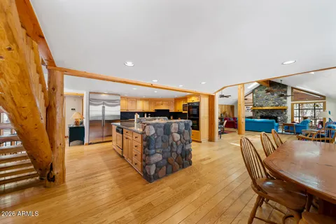 a living room with furniture a ceiling fan and a window