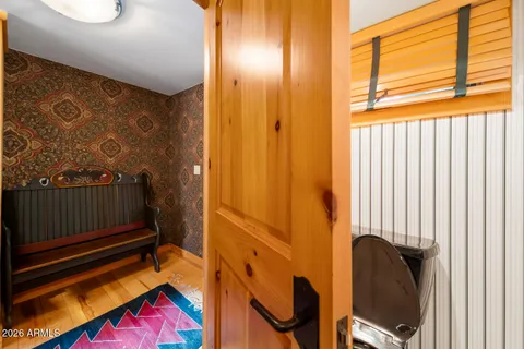 a bathroom with a toilet and a shower curtain