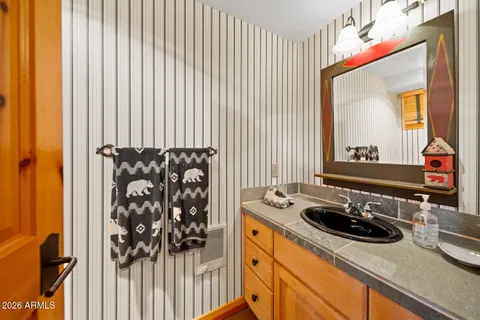 a view of a house with pool and sitting area