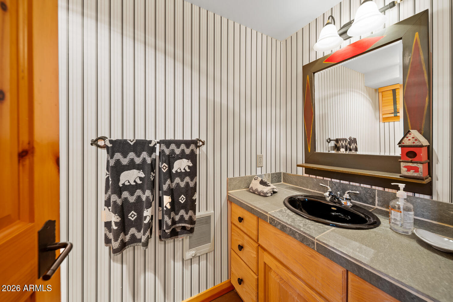 2539 Butterfly Lane Pinetop, AZ 85935 - Photo 45 of 61 a bathroom with a sink and a mirror