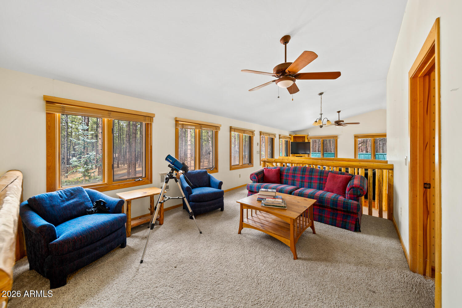 2539 Butterfly Lane Pinetop, AZ 85935 - Photo 51 of 61 a living room with furniture a ceiling fan and a window