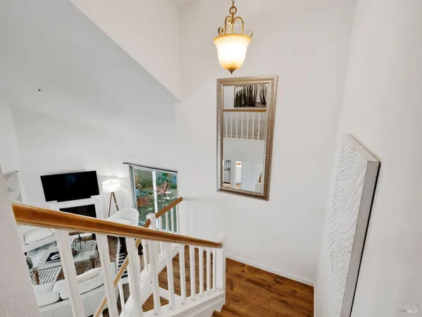 a view of wooden floor and windows in a room