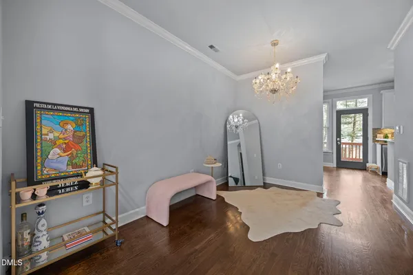 a view of a livingroom with furniture and a flat screen tv