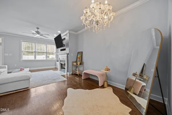 a bedroom with furniture and a chandelier