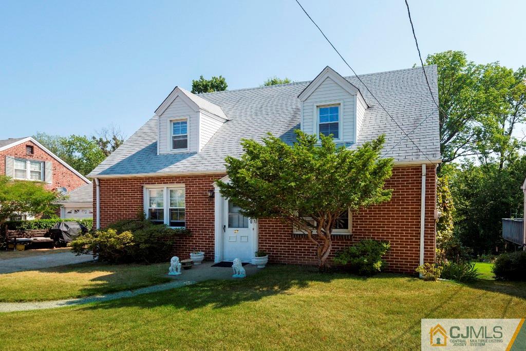 27 Old Post Road Edison, NJ 08817 - Photo 2 of 25 a front view of a house with a yard and garage