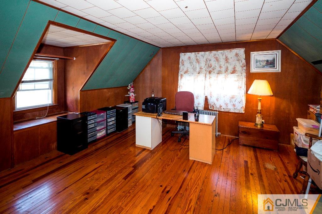 27 Old Post Road Edison, NJ 08817 - Photo 14 of 25 a living room with furniture and a wooden floor