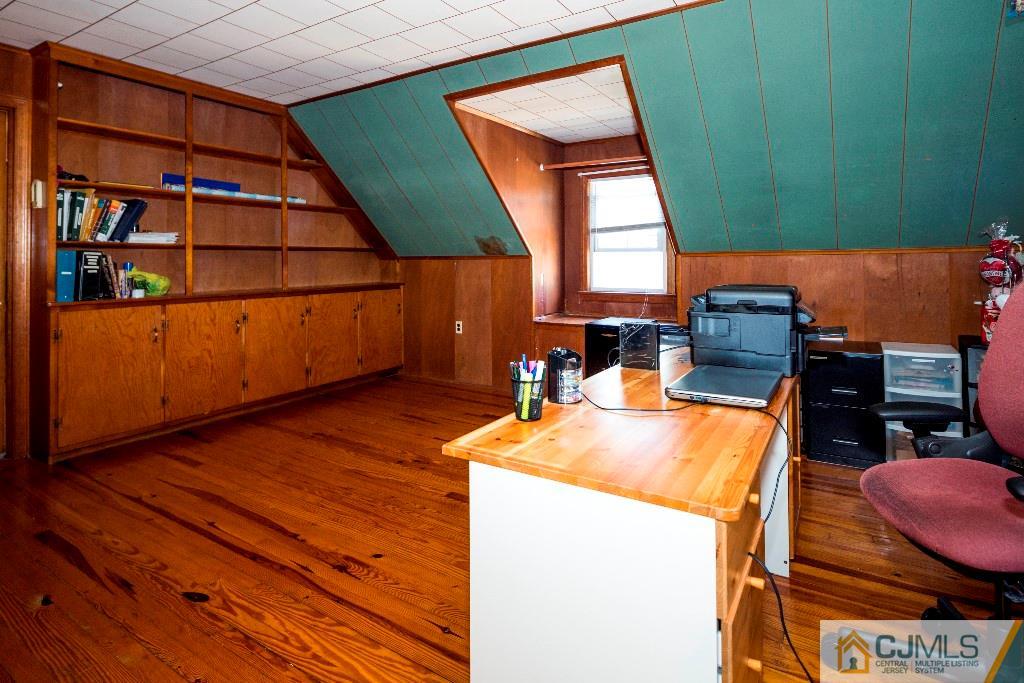 27 Old Post Road Edison, NJ 08817 - Photo 15 of 25 a view of a room with wooden floor and furniture