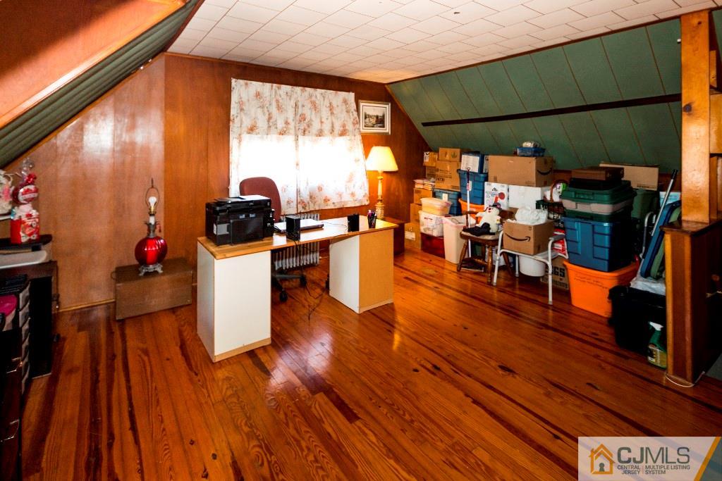 27 Old Post Road Edison, NJ 08817 - Photo 16 of 25 a living room filled with furniture and a wooden floor