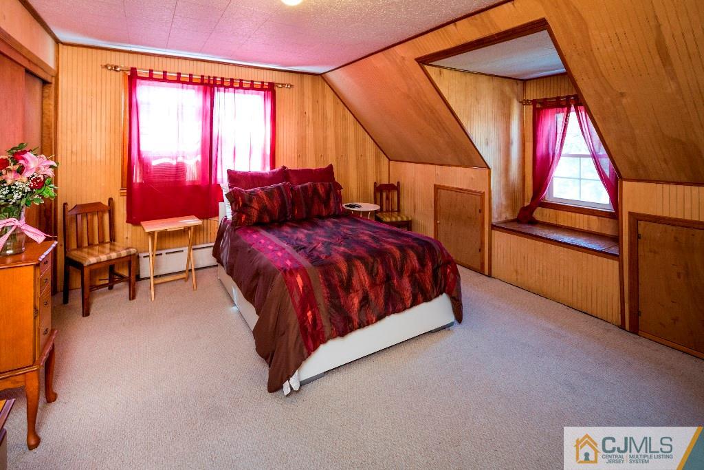 27 Old Post Road Edison, NJ 08817 - Photo 17 of 25 a bedroom with a bed and window