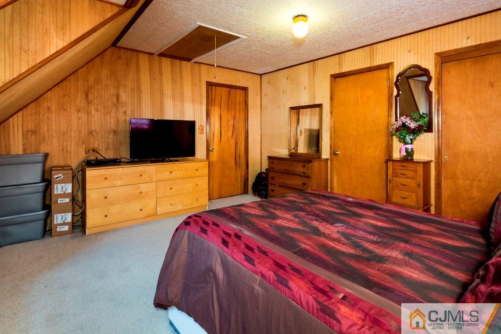 27 Old Post Road Edison, NJ 08817 - Photo 19 of 25 a bedroom with a bed and wooden floor